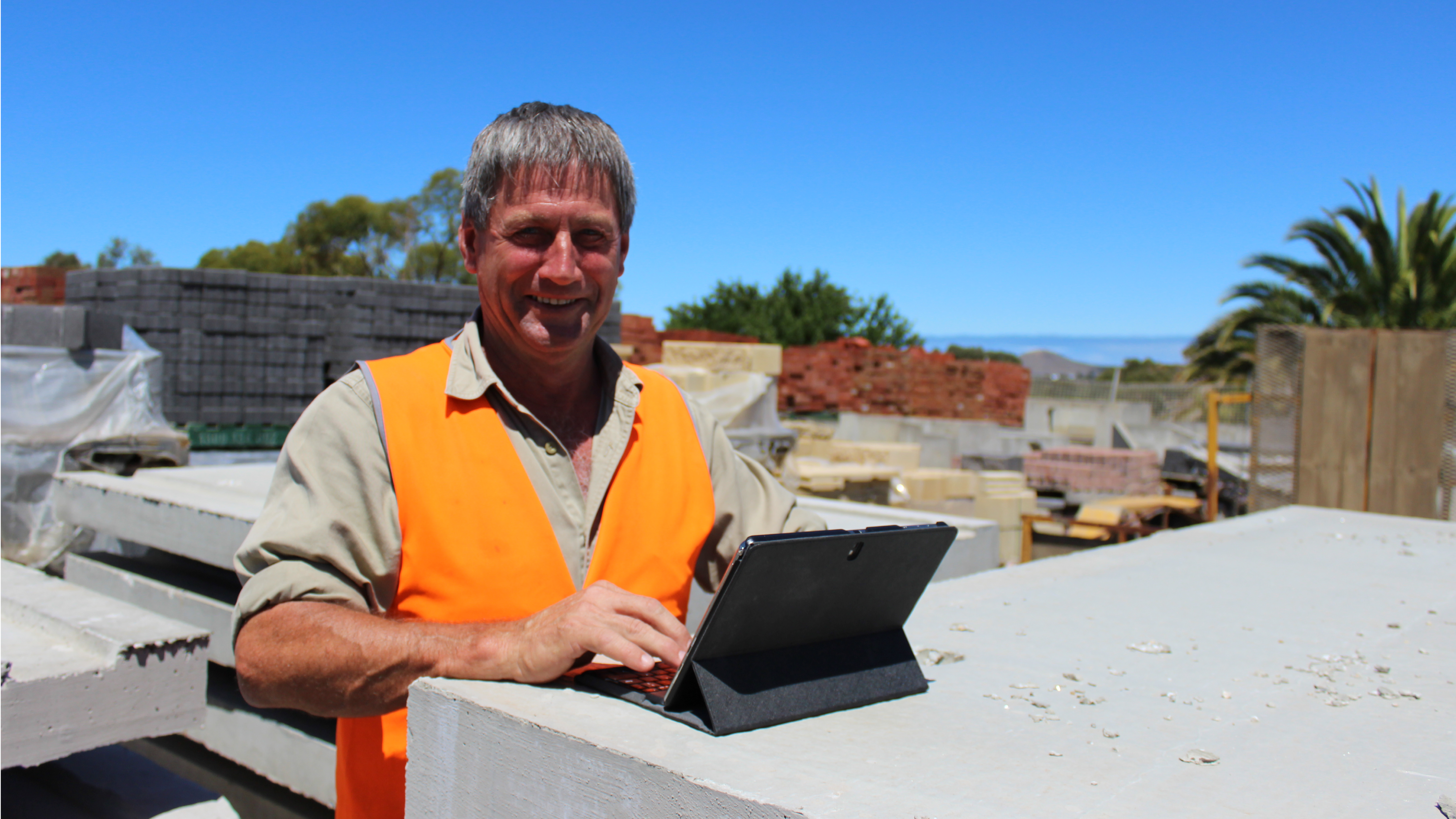 Staff on iPad at construction site