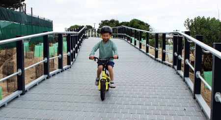 Kid using bike on foreshore bikeway