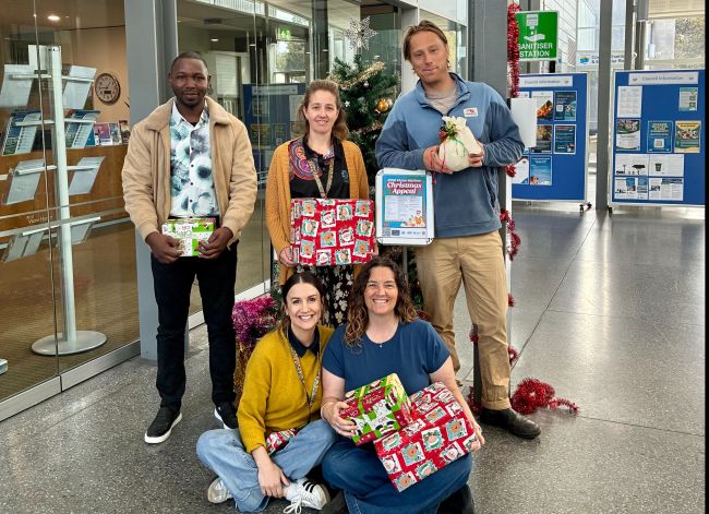 The City of Victor Harbor Fleurieu Families team in front of the Christmas Appeal giving tree