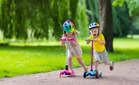 Two kids on scooters
