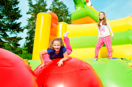 Girls on inflatable castle